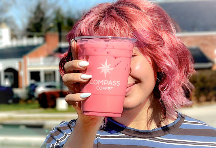 Compass customer enjoying cherry blossom cream cold brew