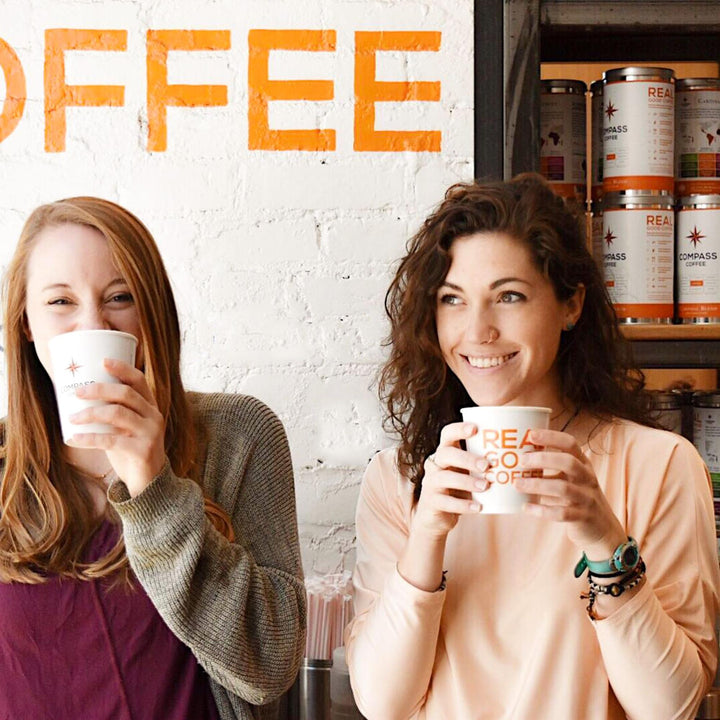 two-girls-enjoying-compass-coffee-drinks